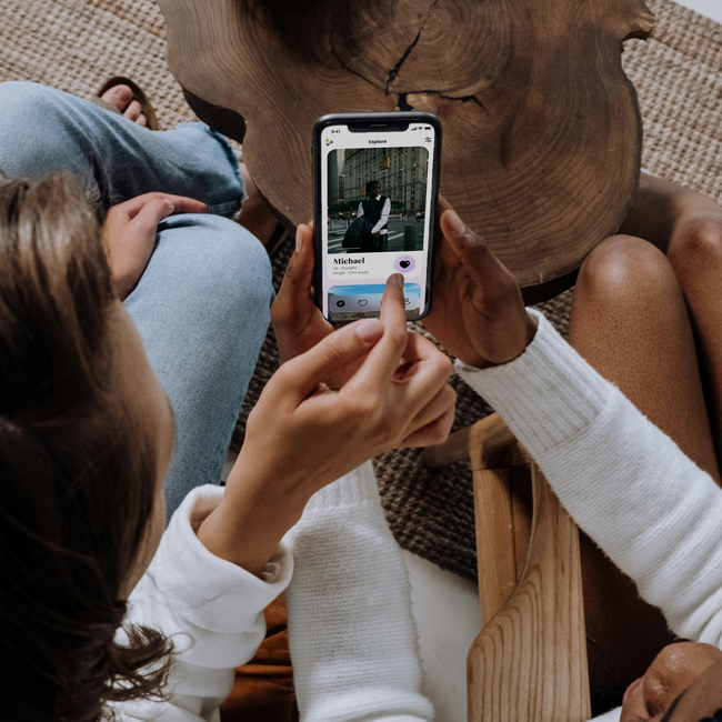 Dating decisions: People using a dating app on a phone. Considering politics and ethics in dating. Online dating and relationship choices.