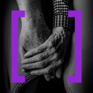 Close-up of elderly hands holding, symbolizing ethics of manhood, support, and aging. Purple brackets frame the image, adding a modern touch.