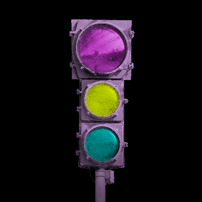 Abstract traffic light with purple, yellow, and teal lights illustrating the future of morality and ethics tune up, on a black background