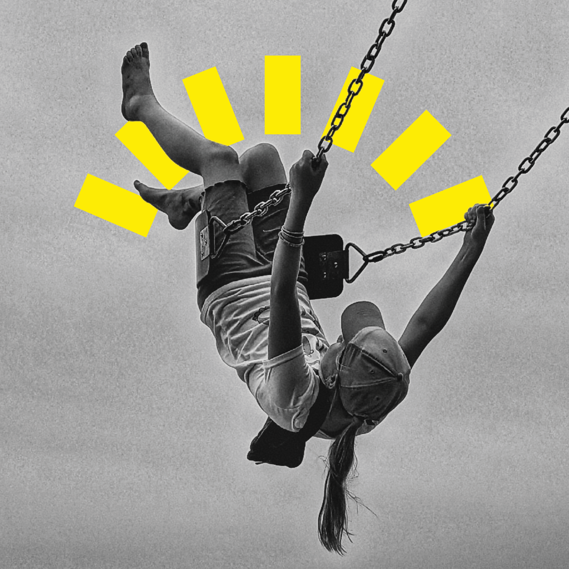 Black and white photo of a barefoot girl swinging upside down, symbolizing the ethics of happiness and joy.