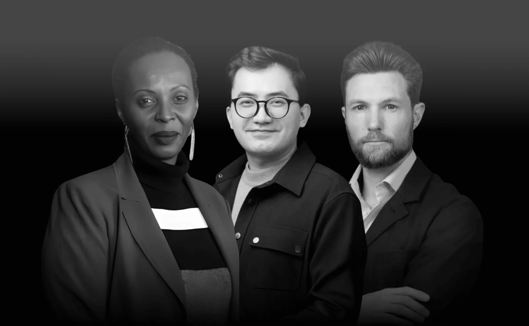 Black and white studio shot of three diverse professionals; a woman in a blazer, a man in glasses, and a bearded man in a suit jacket.